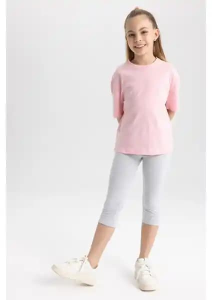 DeFacto Kız Çocuk Kapri Boy Tayt: Rahatlık ve Şıklığı Bir Arada Sunan Yazlık Tasarım