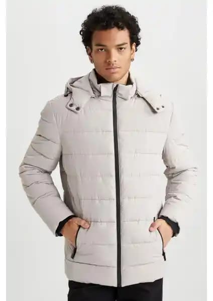 DeFacto Rüzgar Geçirmez Şişme Mont: Modern ve Şık Kış Giyim Seçeneği