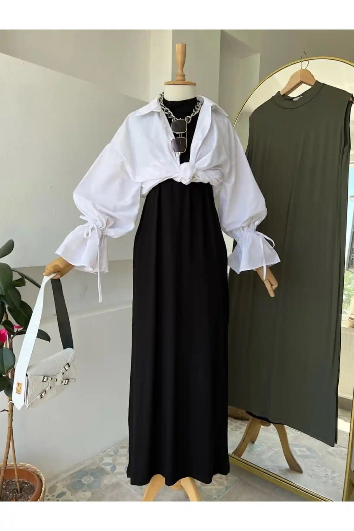 ENDAMIM Yarım Yaka Kolsuz Rahat Kalıp Elbise Modern ve Şık Tasarım Özellikleriyle Öne Çıkıyor