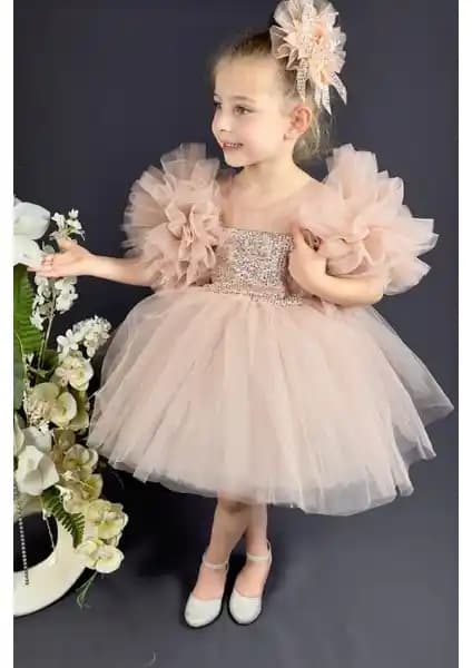 Klasik ve modern detaylarla tasarlanmış pudra rengi çocuk abiyesi, özel günler için ideal