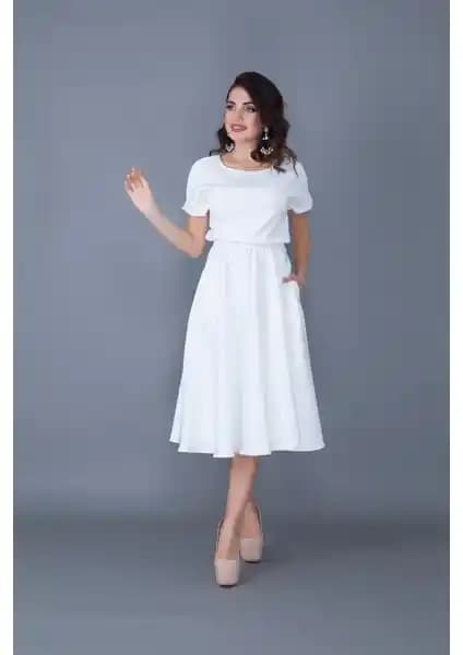 No48 Beyaz Beli Lastikli Cepli Yarasa Kol Midi Elbise: Günlük Şıklık ve Konforun Birleşimi