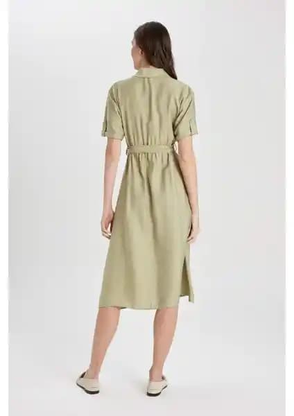 DeFacto'nun Keten Görünümlü Keten Kısa Kollu Midi Elbisesi Modern ve Şık Tasarımıyla Yaz Aylarına Uygun